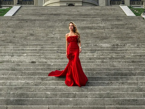 Red-dressed woman on the stairs